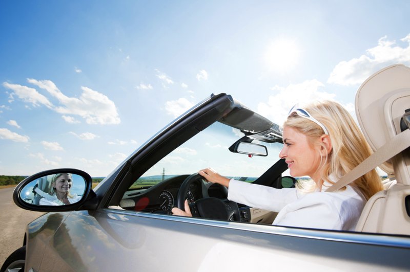 Young blonde businesswoman is enjoying in the road trip. [url=http://www.istockphoto.com/search/lightbox/9786750][img]http://dl.dropbox.com/u/40117171/summer.jpg[/img][/url]